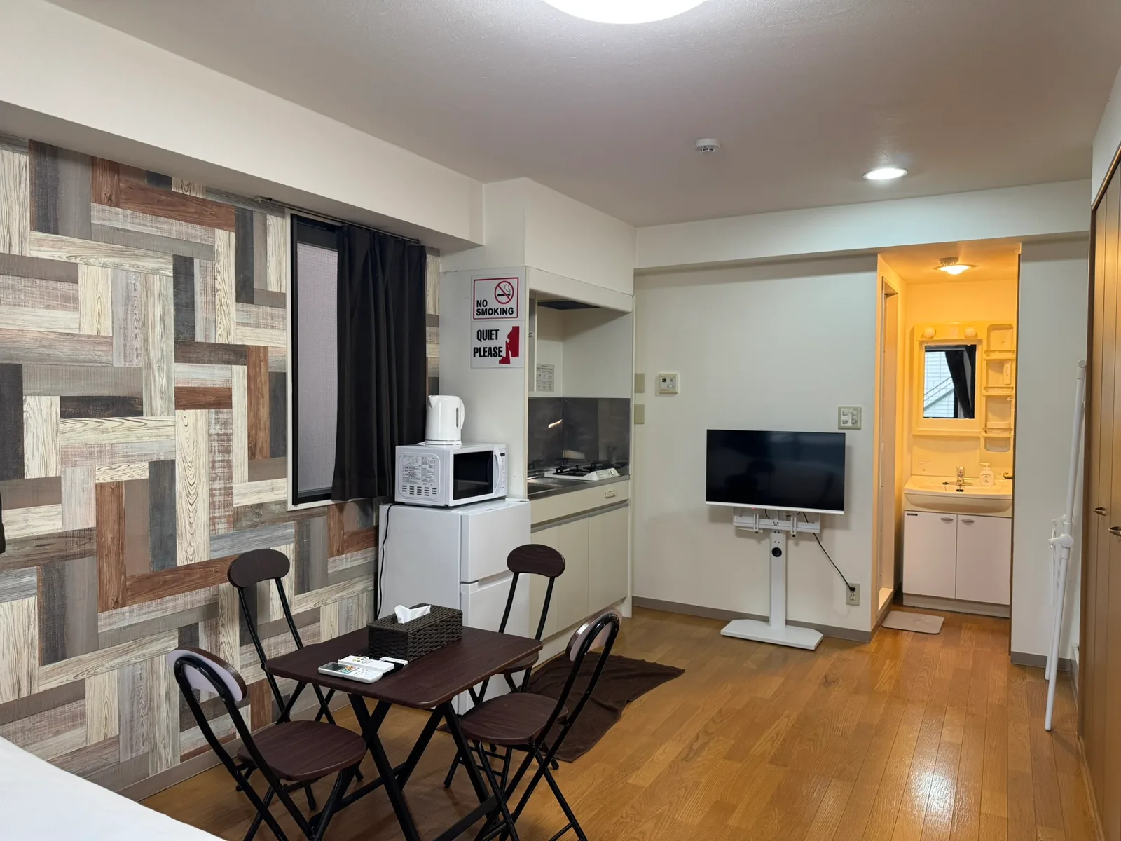 The room, with the kitchen